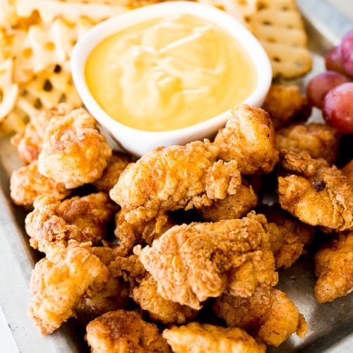 Chick fil a nuggets on a tray with waffle fries