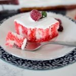 white cake with raspberry jello to make a raspberry poke cake