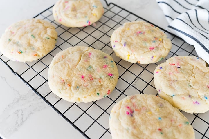 birthday cake cookies on a cooling rack
