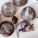 molten lava cookies on a counter with hot fudge sauce