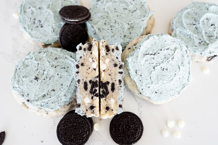 Aggie blue mint cookie, cut in half and arranged on the counter with two other cookies