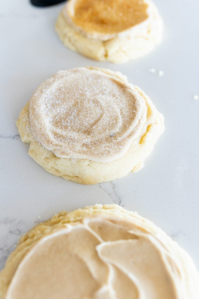 creme brûlée cookie with sugar pressed onto the top of the frosting.