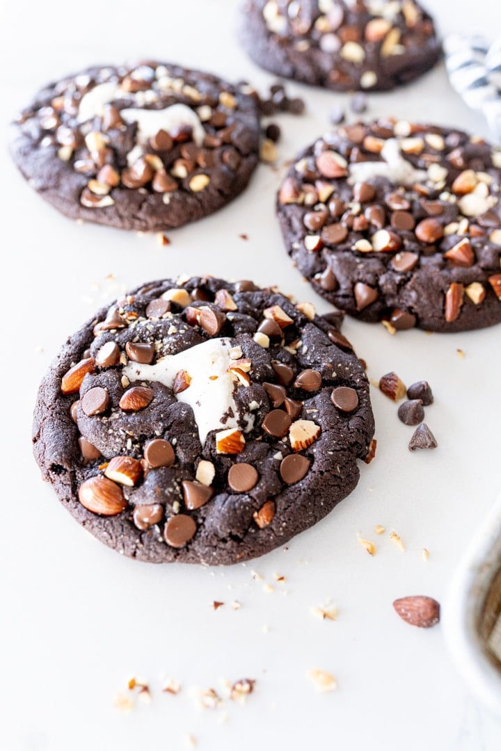 Fudgey chocolate cookie with chocolate chips, almonds and marshmallow in the middle to complete this crumbl copycat rocky road cookie.