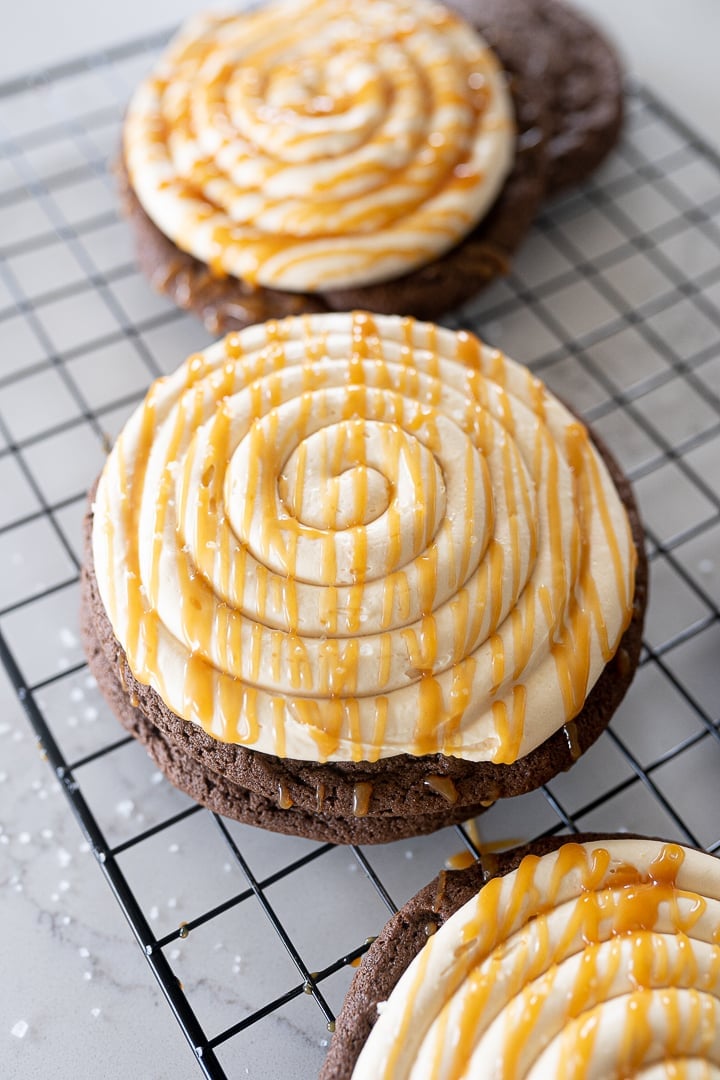 caramel chocolate cheesecake cookie on a cookie cooling rack