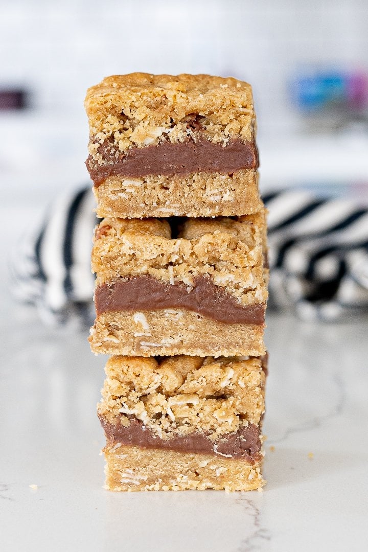 oatmeal fudge bars stacked on top of each other on the counter
