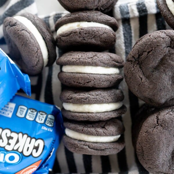 Oreo cakesters stacked on top of each other on a striped dishtowel