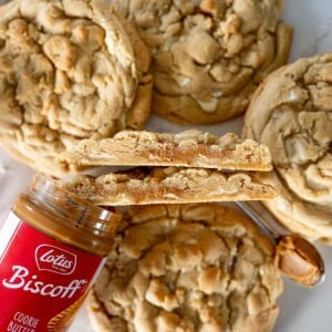 cookie butter stuffed white chocolate chip cookies cut in half