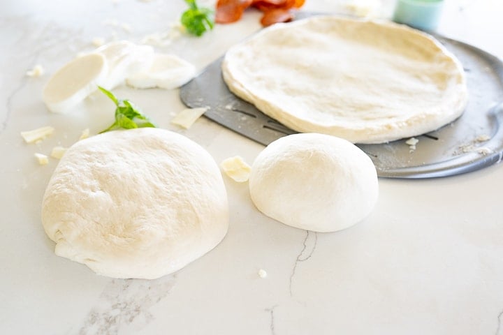 pizza dough on the counter before being stretched to size.