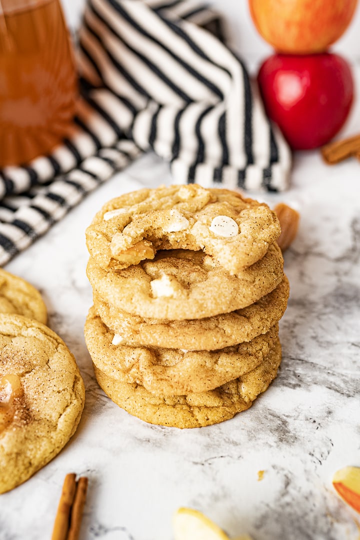 caramel apple cider cookies stacked on top of each other. 