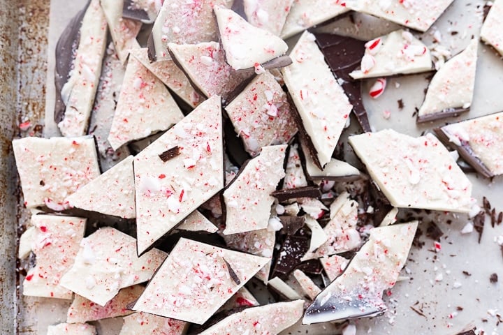 Large pile of Ghiradelli peppermint bark laid out on the counter.