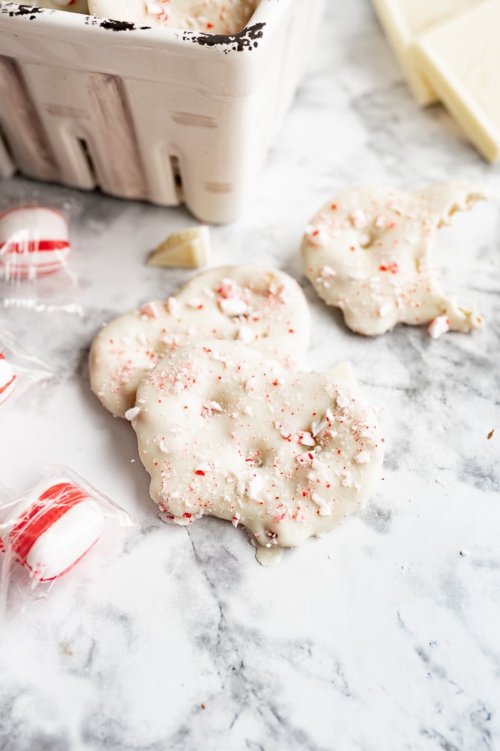 white chocolate pretzel crisps on the counter next to some peppermints.