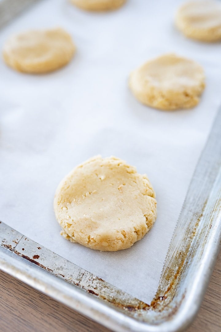 Flatten cookie dough in portions on a cookie sheet with parchment paper.