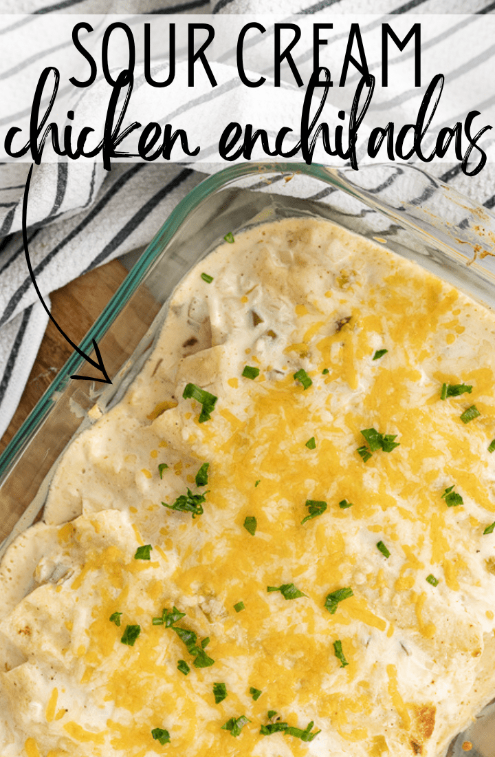 A casserole dish of sour cream enchiladas with text on the photo that reads "sour cream chicken enchiladas."