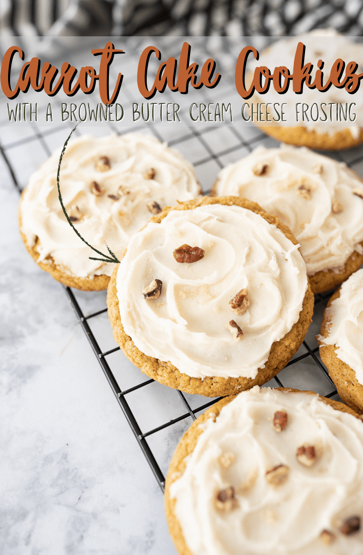 Frosted Cookies on a cooling rack with brown text on the photo that reads "Carrot Cake Cookies with a browned butter cream cheese frosting."