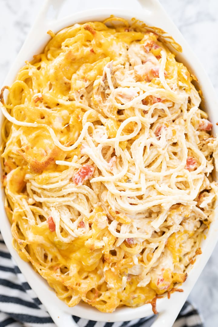 Close up of baked chicken spaghetti casserole in a dish. 