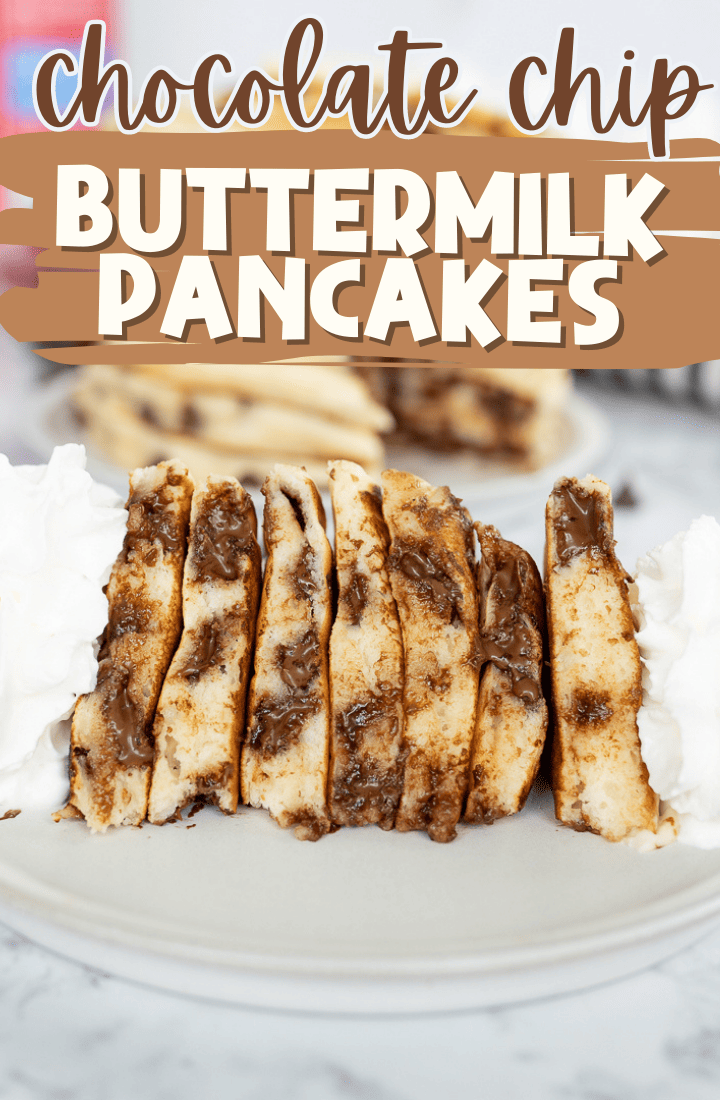 Side view of a stack of chocolate chip pancakes, cut and on its side. Topped with whipped cream. Across the top it says "Chocolate chip buttermilk pancakes" in text.