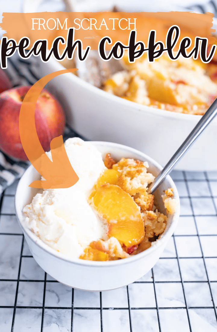 A bowl of homemade peach cobbler topped with ice cream and a spoon sits on a counter next to a bigger serving dish of the cobbler. Across the top it says "from scratch peach cobbler" in text.