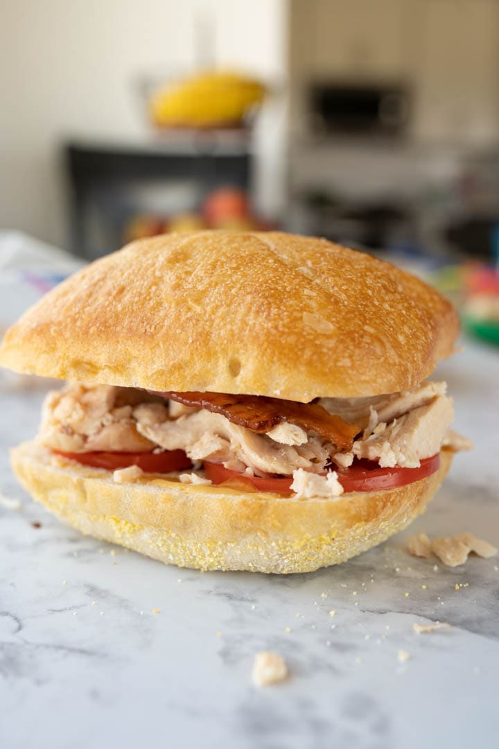 A chicken panini assembled prior to being grilled.