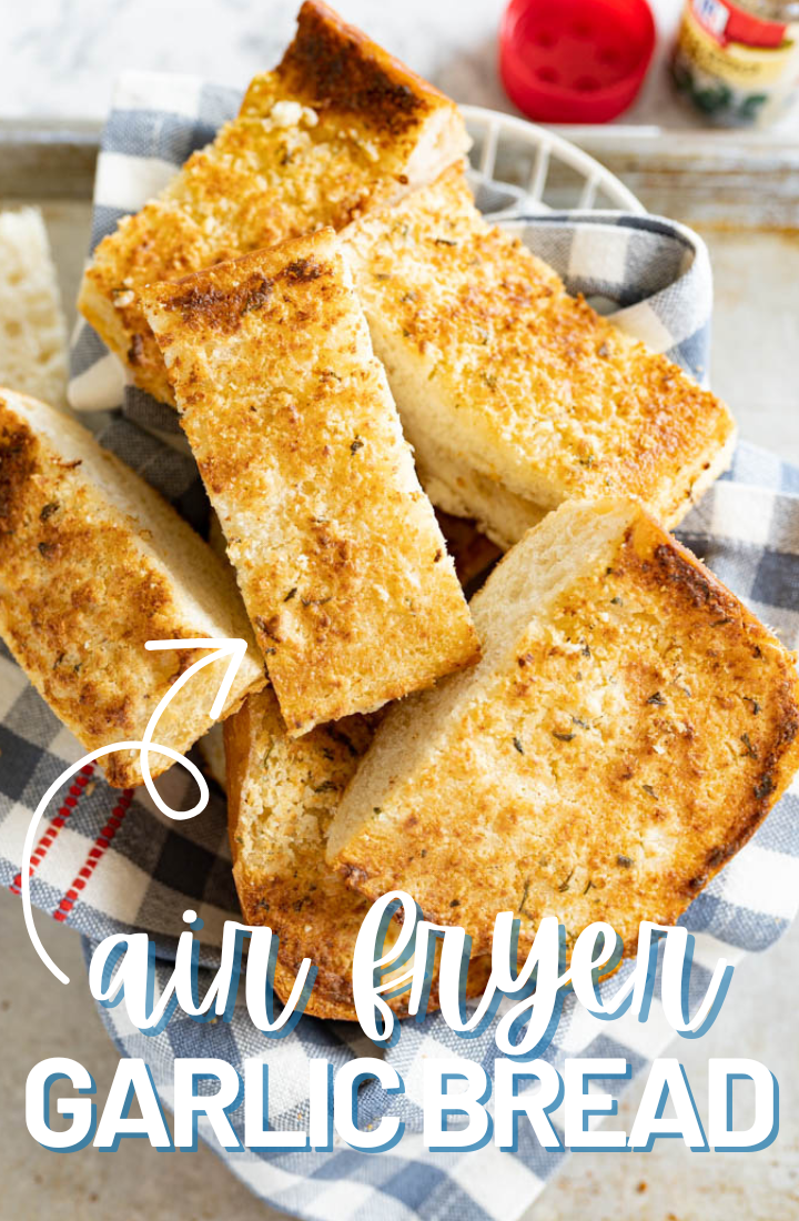 A pile of buttery garlic bread made in the air fryer on the counter. Across the top it says "air fryer garlic bread" in text.