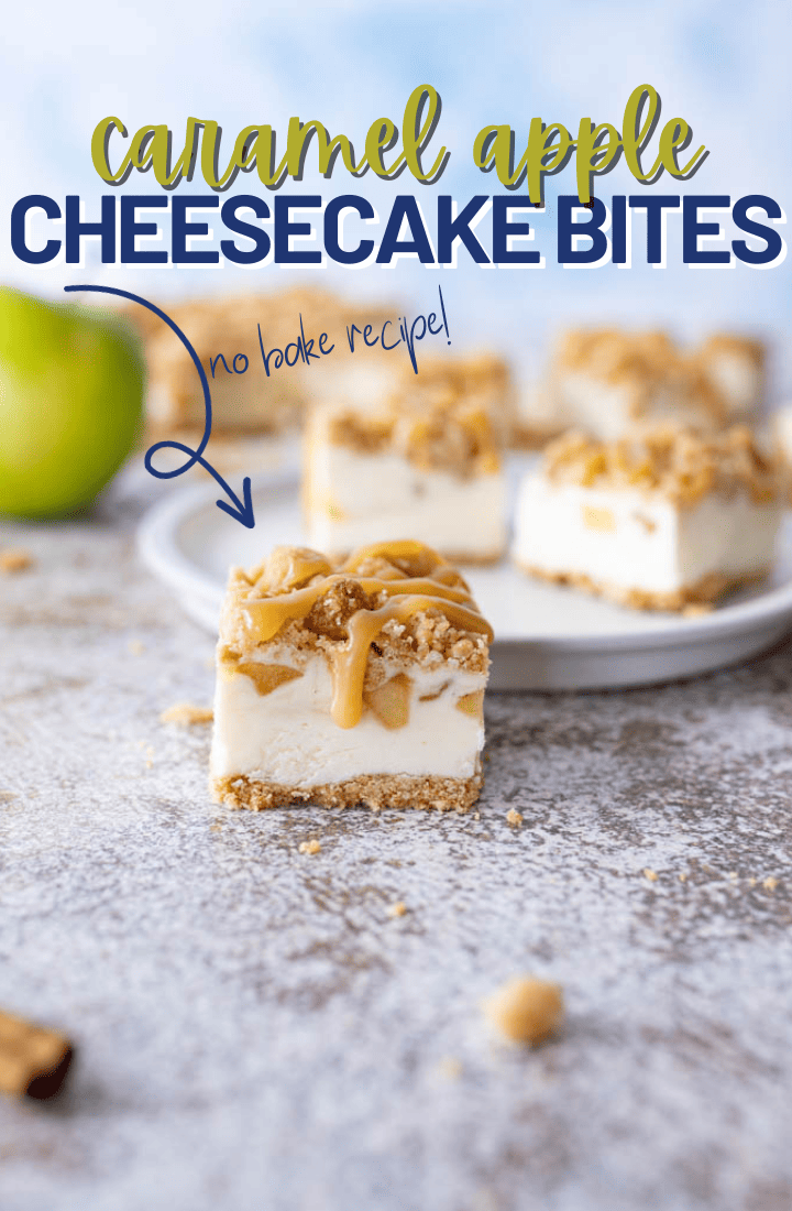 A caramel apple cheesecake bar sitting on the counter next to a plate filled with additional bars and a green apple. Across the top it says "caramel apple cheesecake bites"