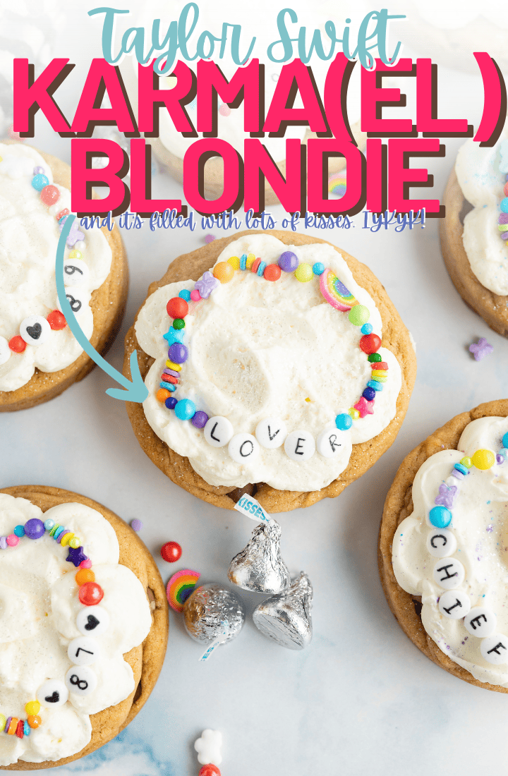 Aerial view of Taylor Swift x Travis Kelce cookies with taylor swift friendship bracelets. Across the top it says "Taylor Swift Karma(el) blondie and its filled with lots of kisses" 