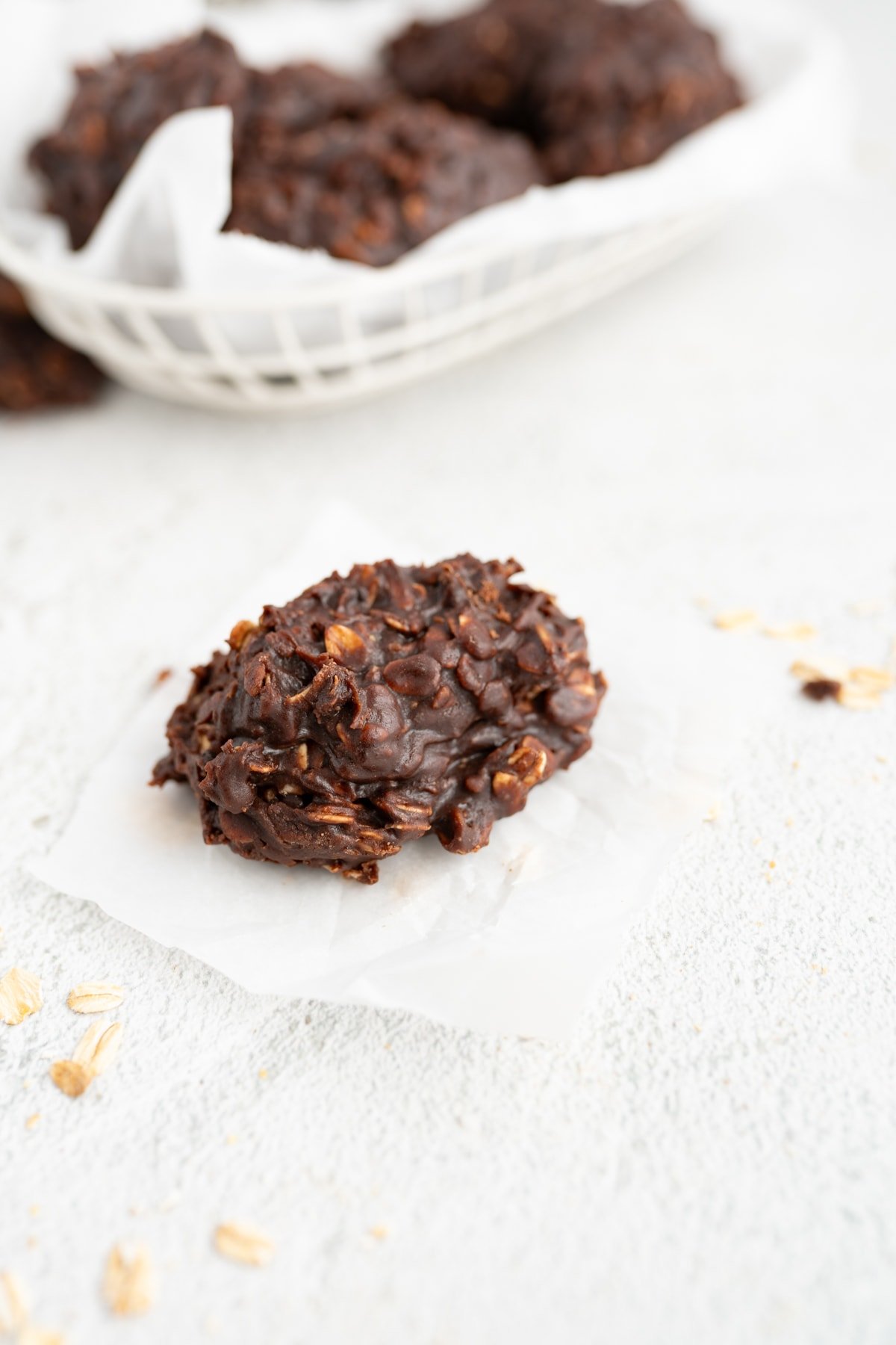 A single chocolate no bake oatmeal cookie on the counter. 