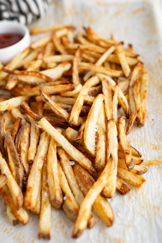 Close up of a pile of crispy oven baked fries. 