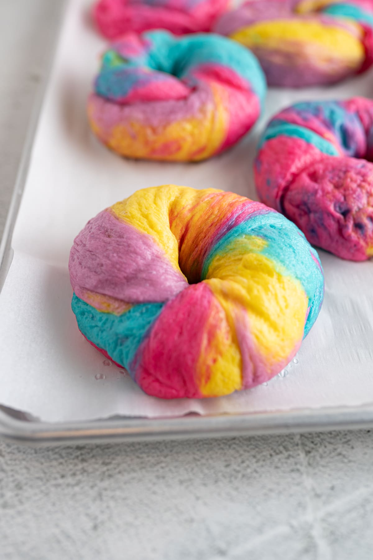 Close up of a finished rainbow bagel. 