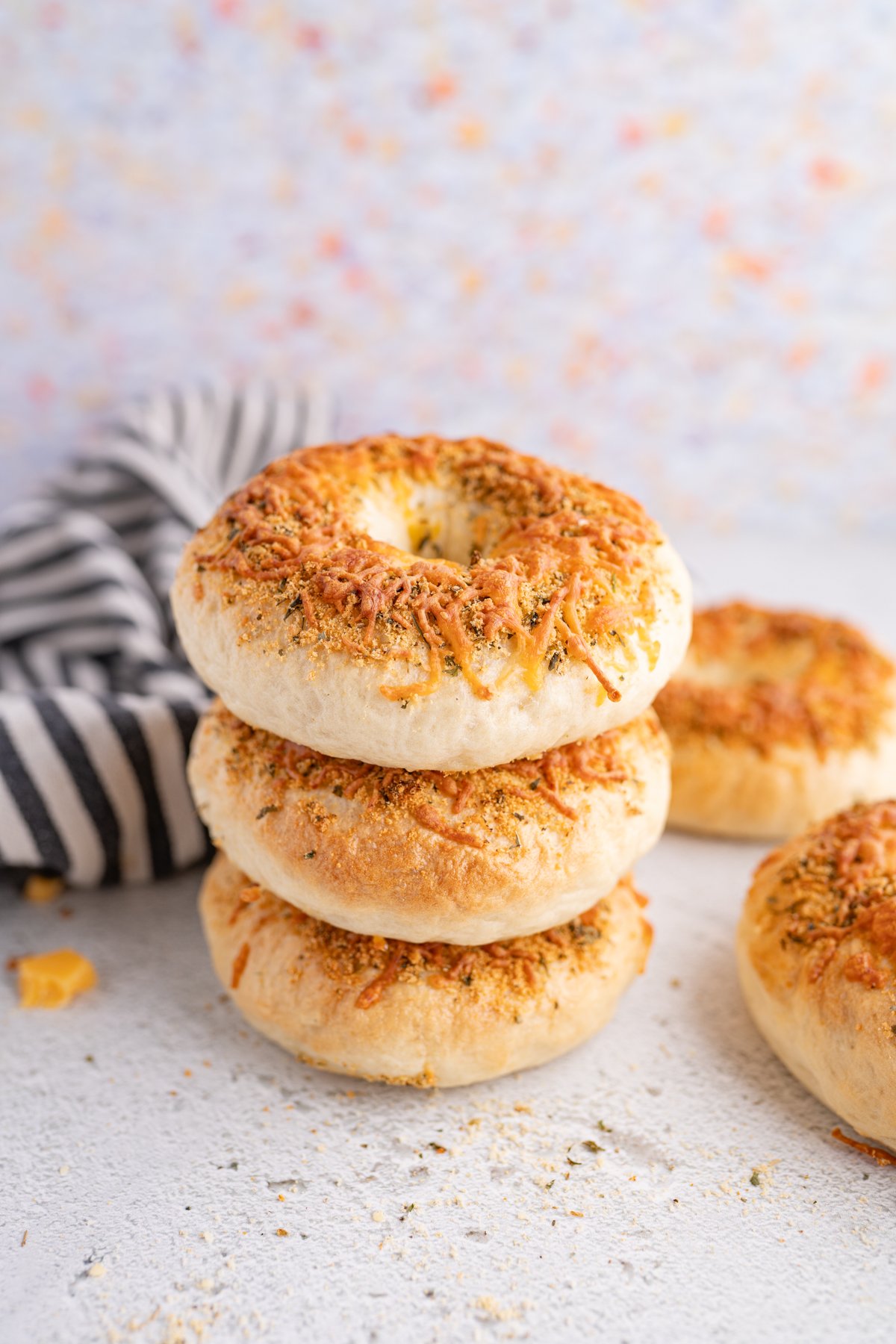 A stack of italian herb bagels. 