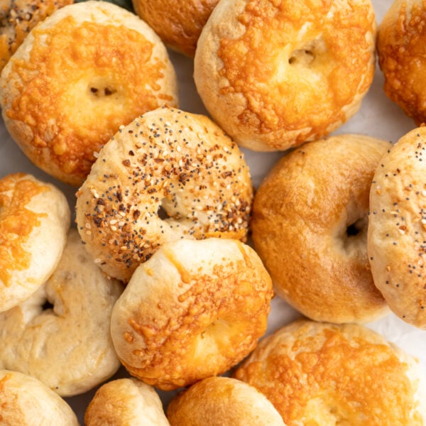 Close up of mini bagels with assorted toppings.