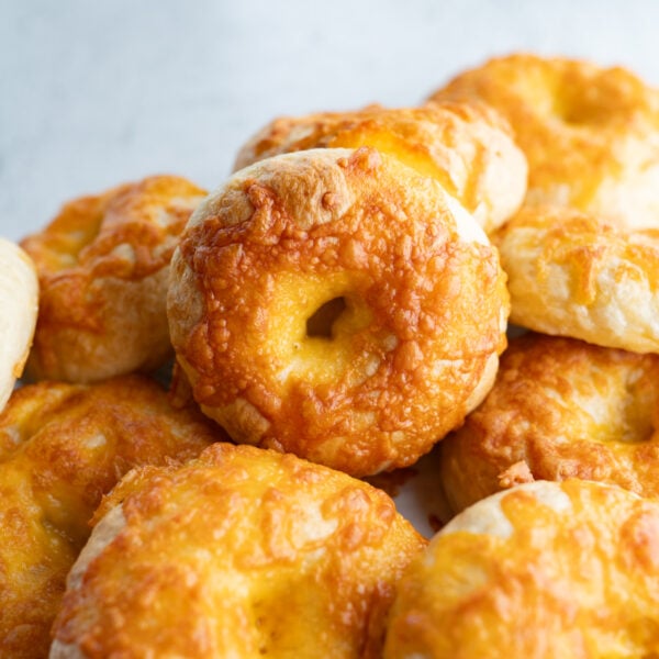 A pile of homemade cheddar bagels.