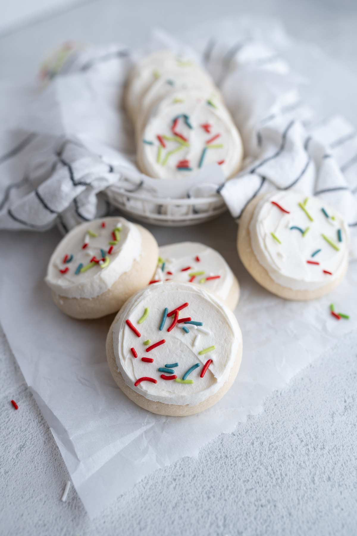 Christmas loft house sugar cookies spilling out of a basket. 