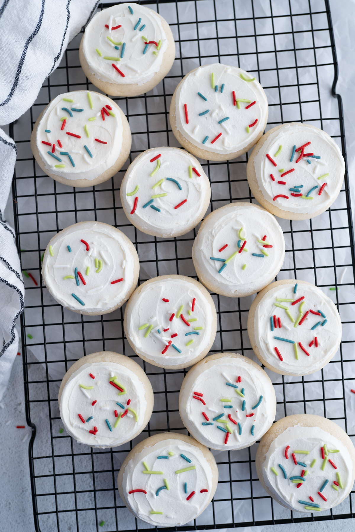 Christmas sugar cookies on a wire cooling rack. 