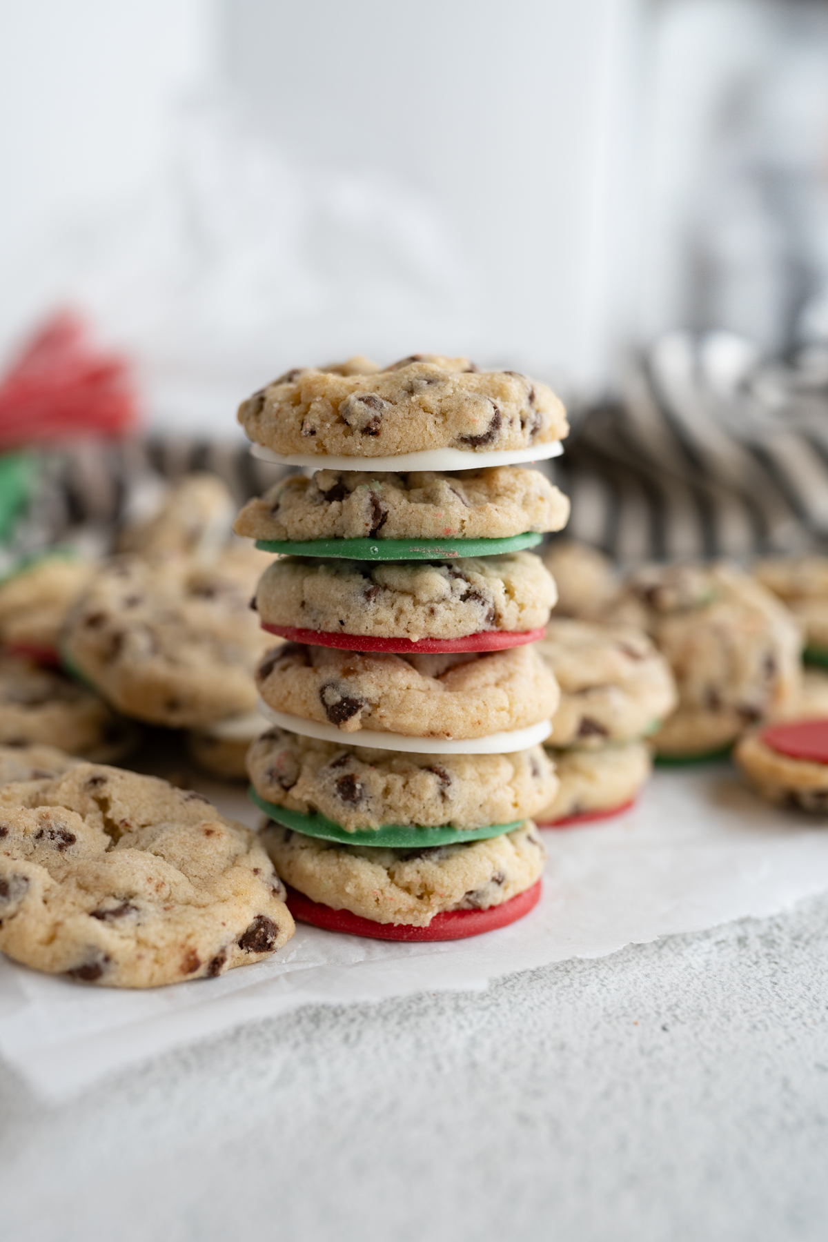 A stack of mini cookies decorated for Christmas. 