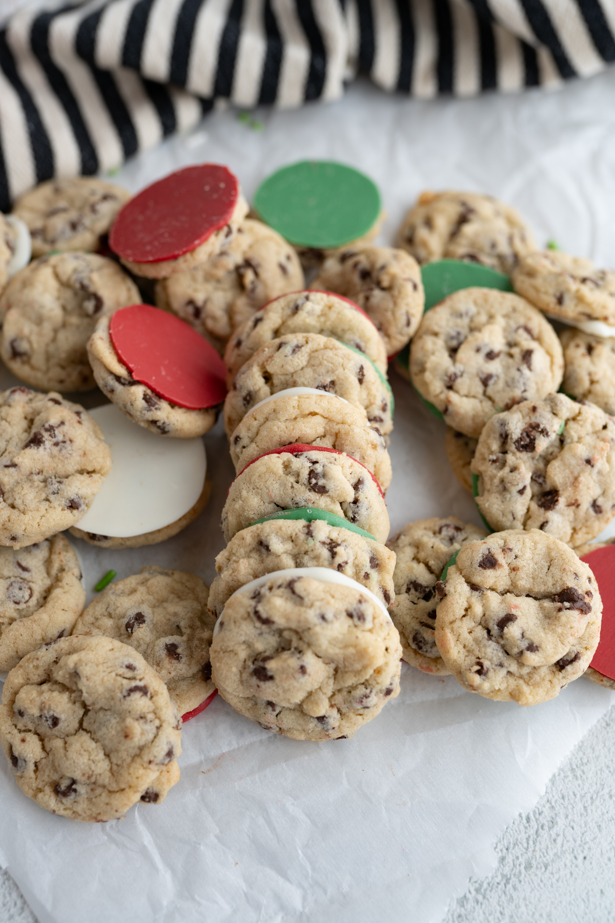 A horizontal stack of mini jacques torres cookies for Christmas. 