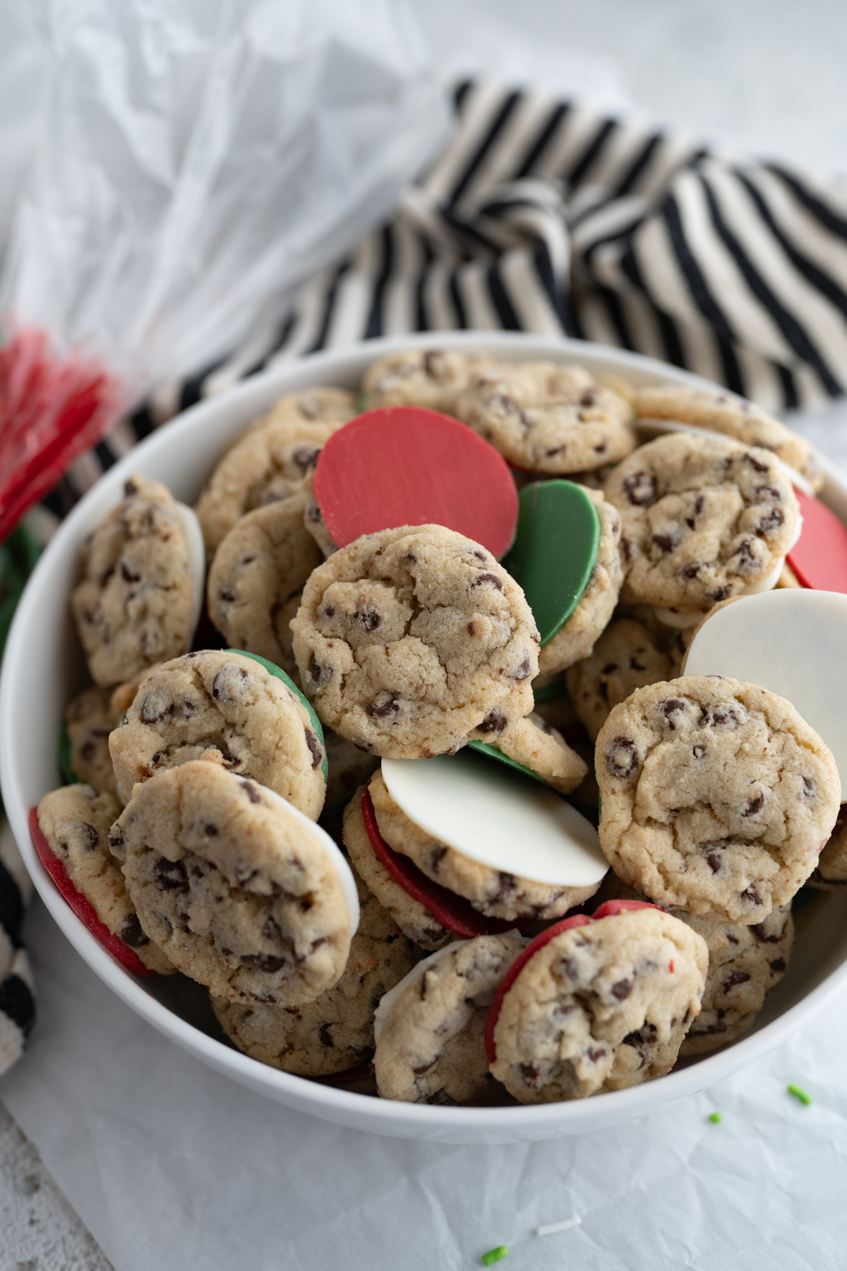 Bowl filled with mini christmas chocolate chip cookies. 
