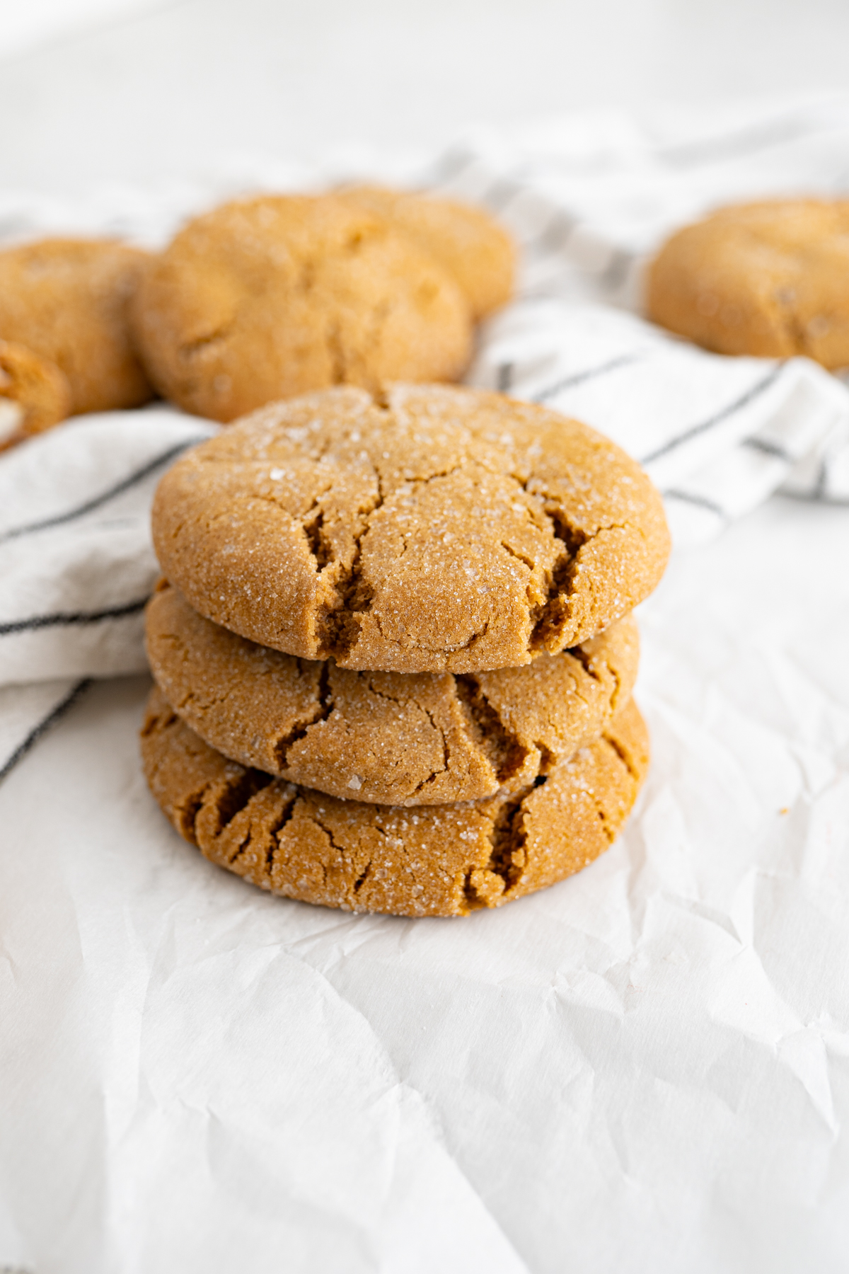 A stack of stuffed gingerbread cookies with a crinkled exterior. 