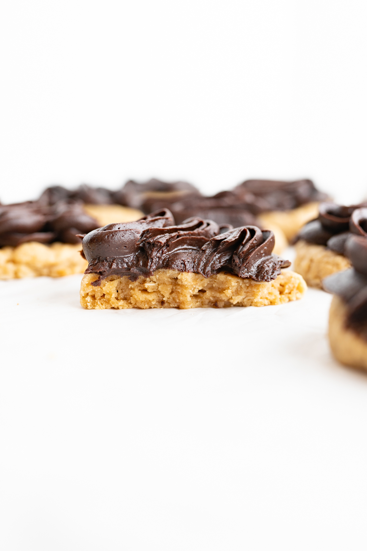 Side view of a peanut butter bar cookie cut in half.