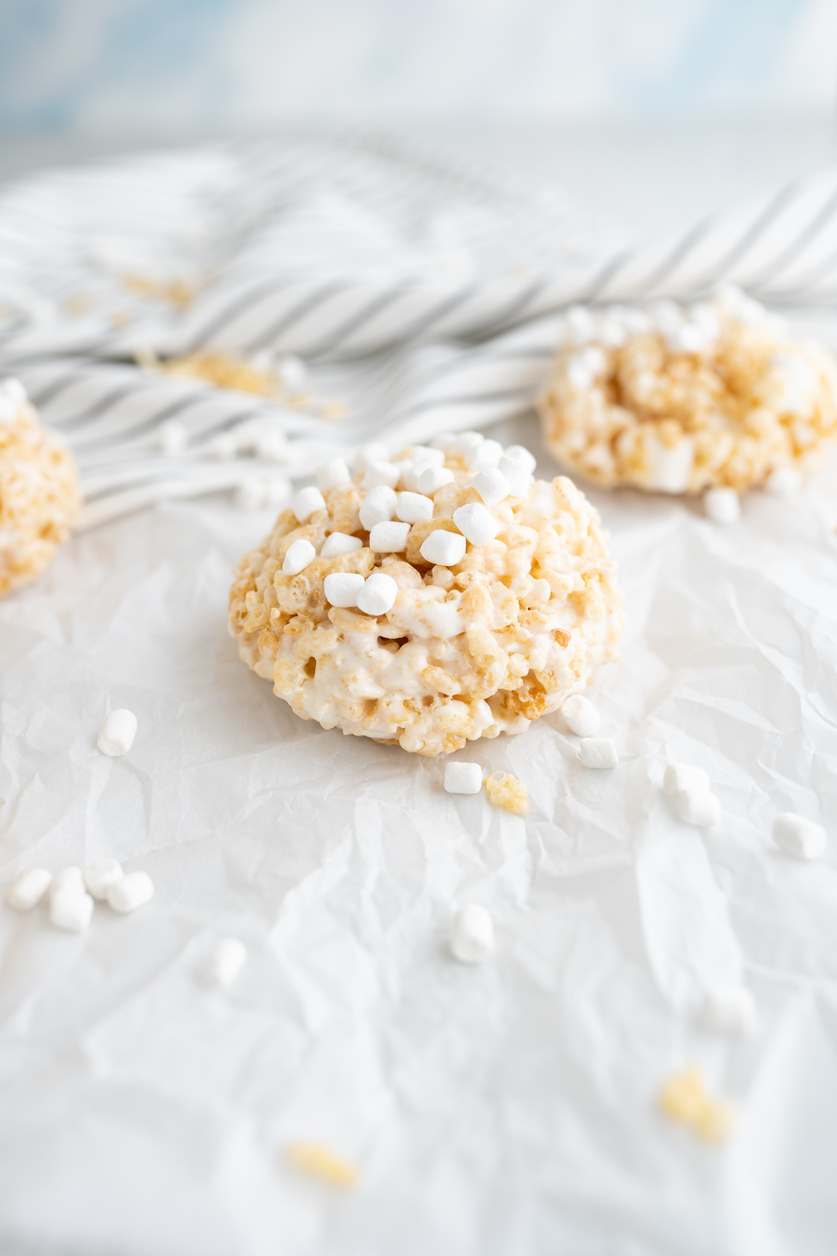 Side view of rice krispie treats shaped into cookies. 