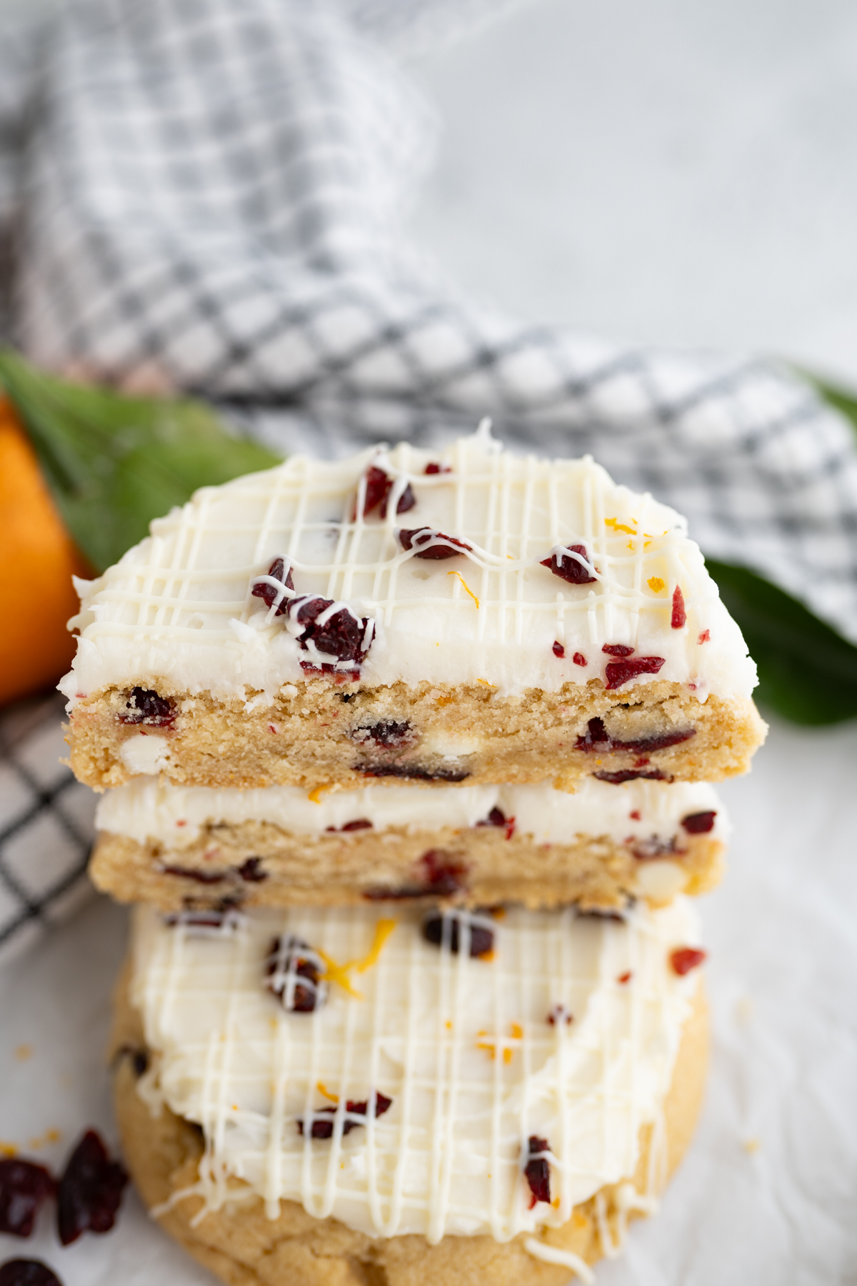 Close up of blondie orange cookie with cranberries and white chocolate like Starbucks Bliss Bars. 