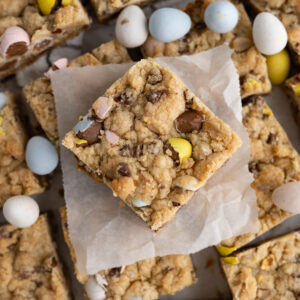 Close up of a Cadbury Mini Egg Cookie bar made with chewy oats and extra chocolate chips.