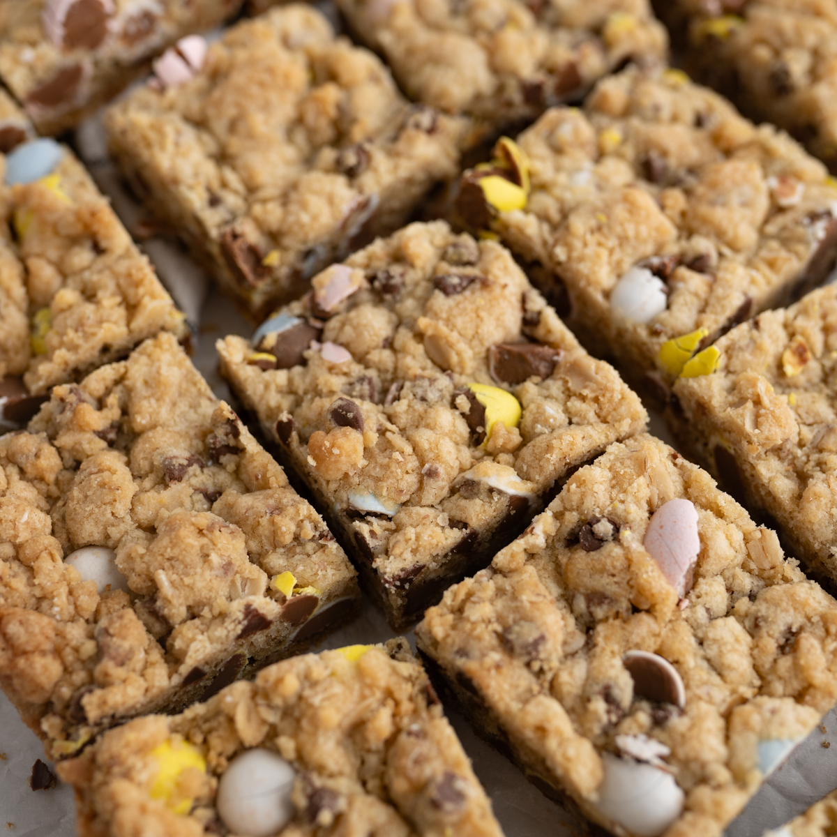 close up of the texture of Easter cadbury mini egg cookie bars. 