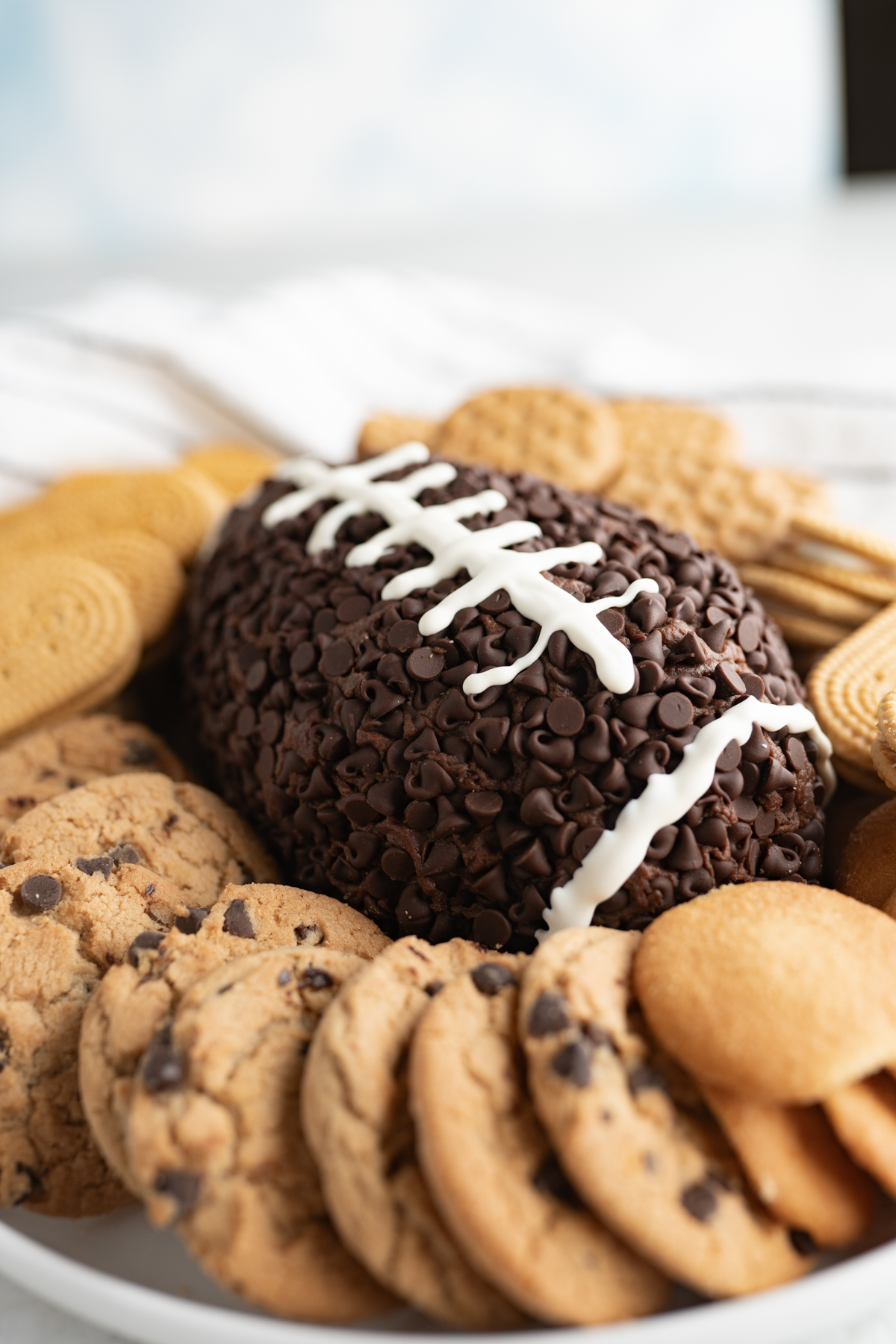 A Super Bowl snack tray with a football chocolate cheeseball. 