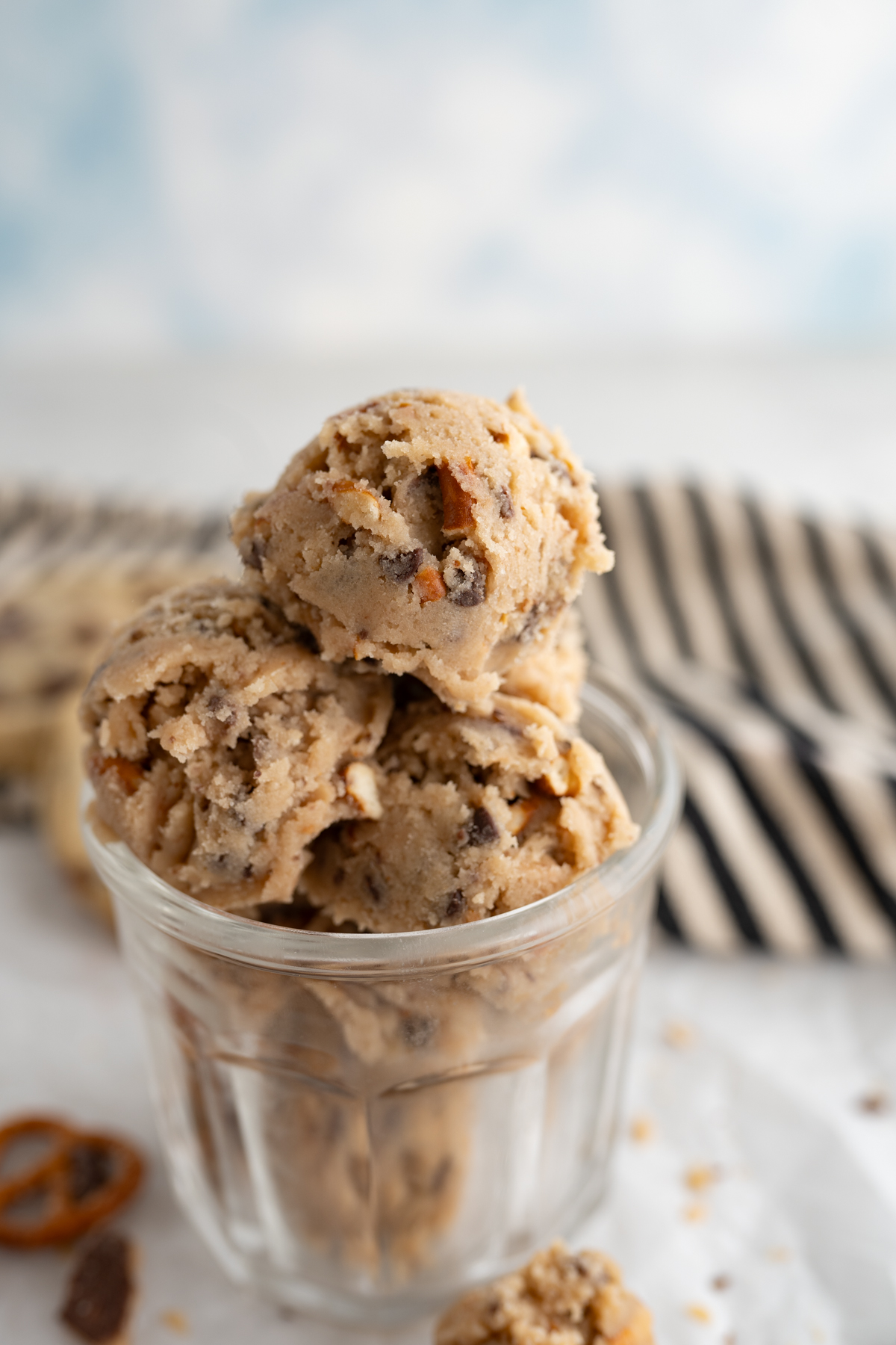 Close up of edible cookie dough balls with pretzels and toffee. 