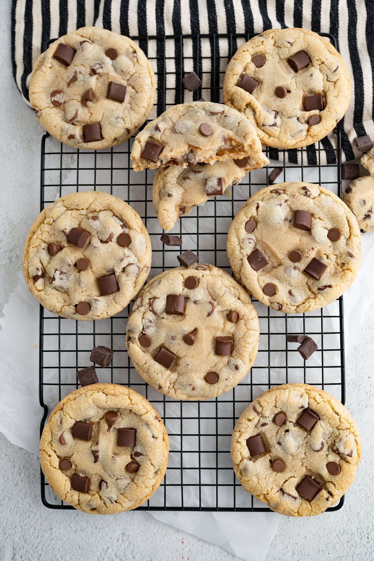 Aerial view of ultimate chocolate chip cookies on a wire cooling rack.