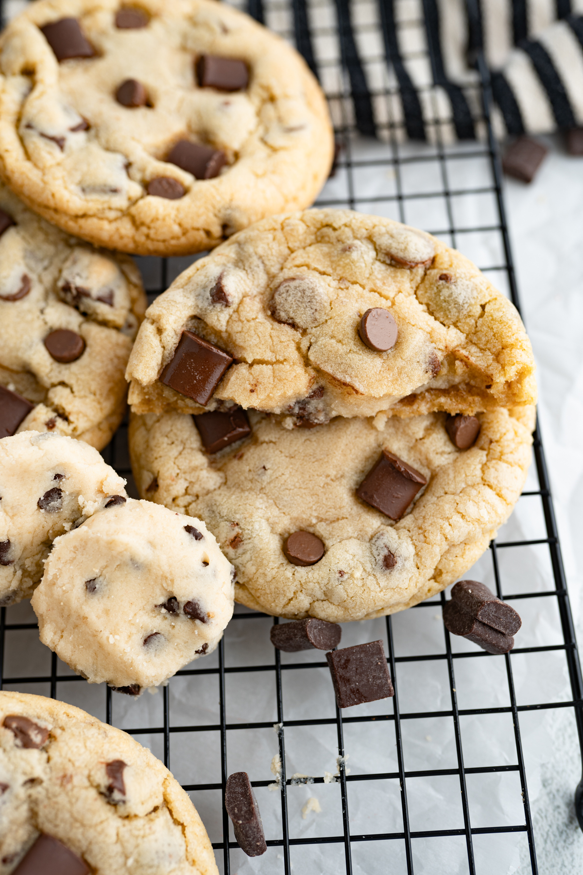 View of a chocolate chip cookie stuffed with cookie dough buttercream.