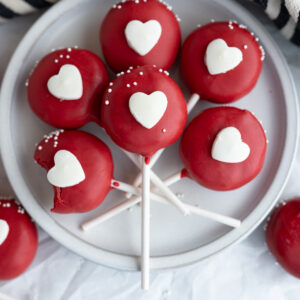 A red cake pop with a white heart to copycat the Starbucks Valentine Cake Pop.