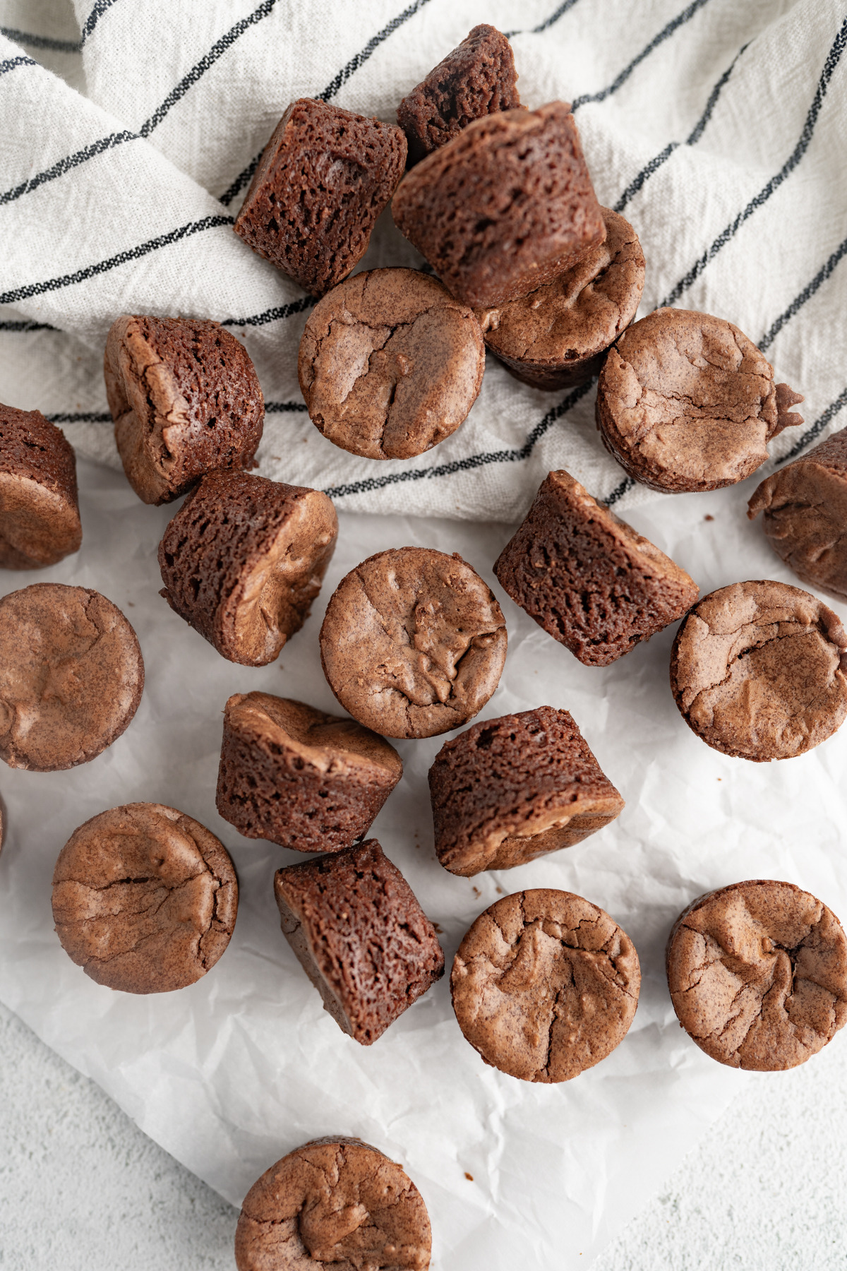 Brownie bites scattered on the counter.