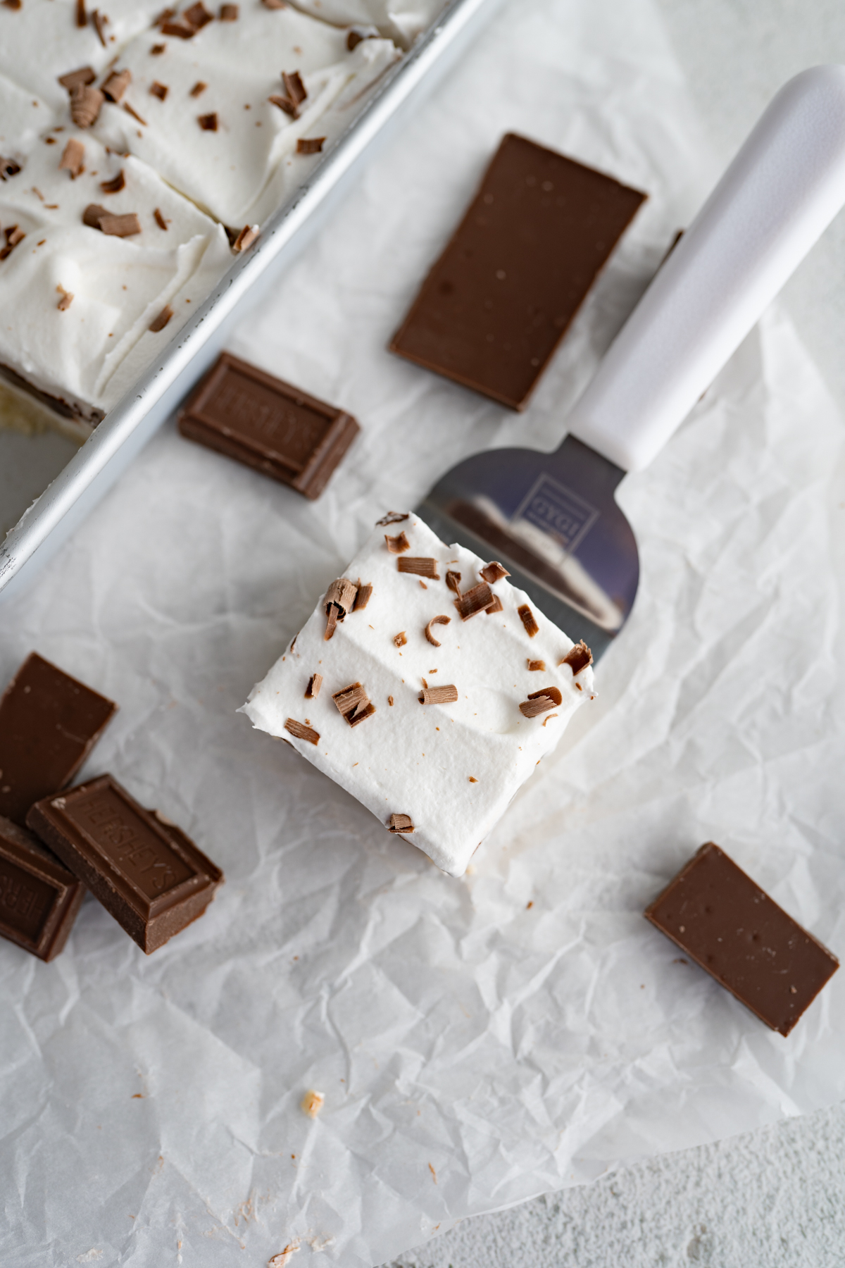 A slice of chocolate lush on a serving spatula. 