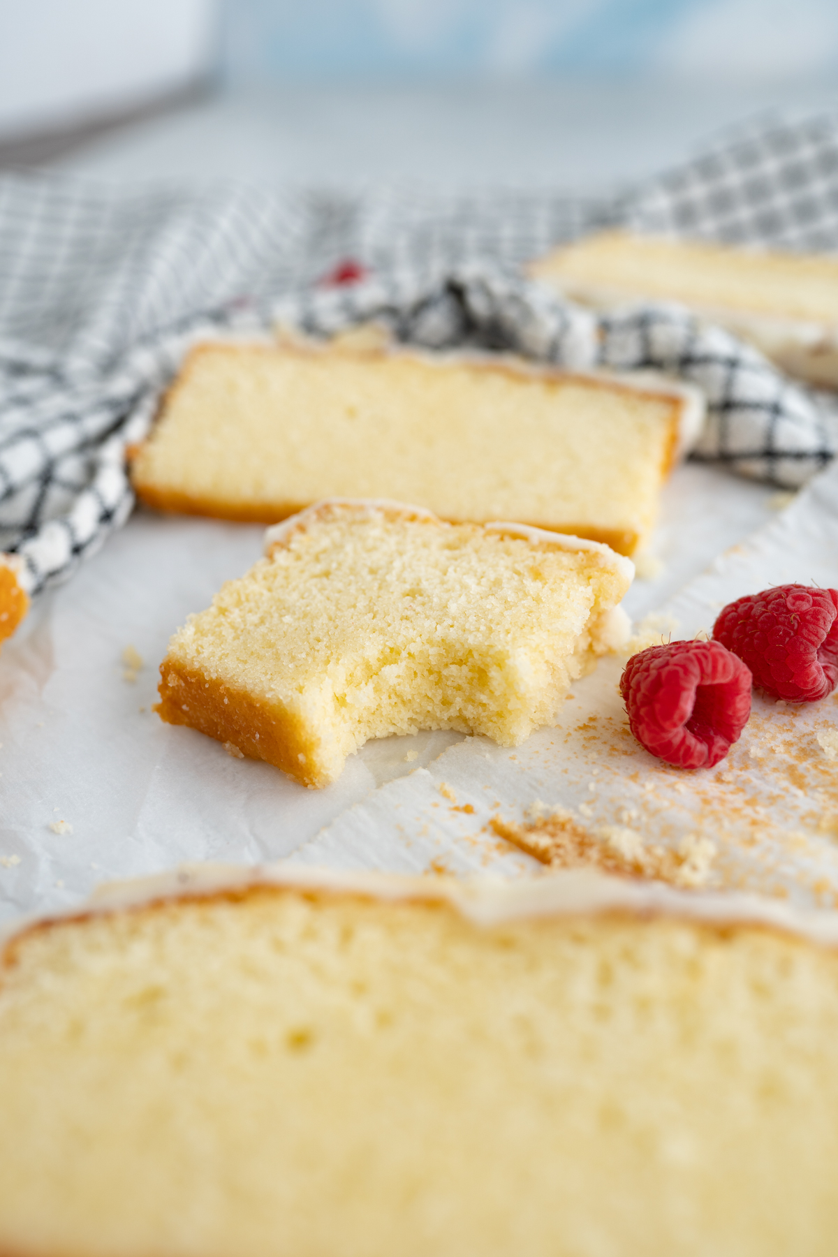 A bite taken out of moist almond pound cake. 